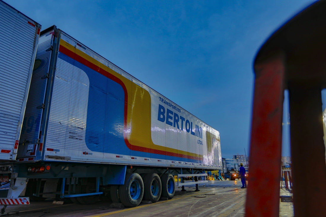 blue and orange freight truck on road during daytime