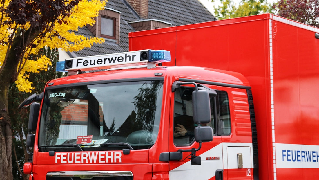 a red truck parked in front of a house